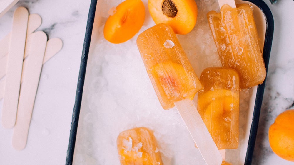 Afbeelding van oranje perzik ijsjes uit de vriezer